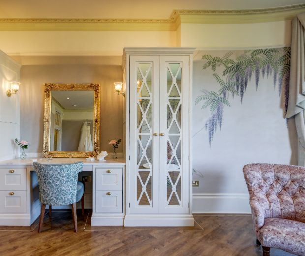 Hylands Estate Wedding Suite Wisteria Room with seating areas and a makeup station. 