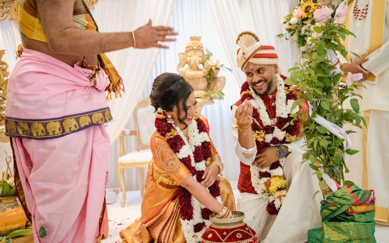 Ratha and Rath smiling during their ceremony